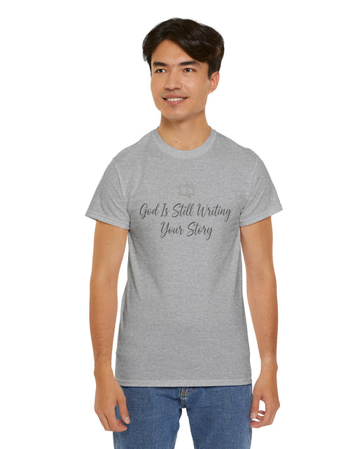 Load image into Gallery viewer, God Is Still Writing Your Story Tee — Inspirational Christian Faith Men's &amp; Women's T-Shirt
