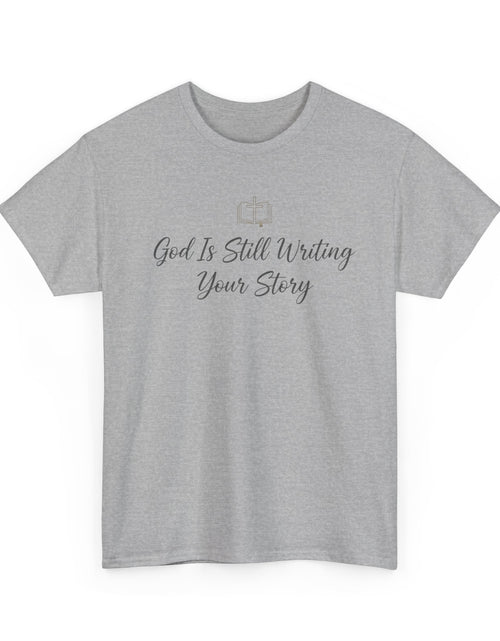 Load image into Gallery viewer, God Is Still Writing Your Story Tee — Inspirational Christian Faith Men's &amp; Women's T-Shirt
