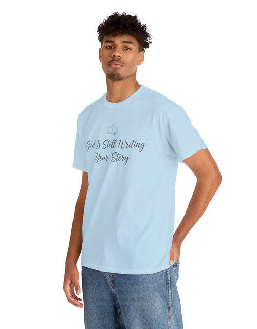 Load image into Gallery viewer, God Is Still Writing Your Story Tee — Inspirational Christian Faith Men's &amp; Women's T-Shirt

