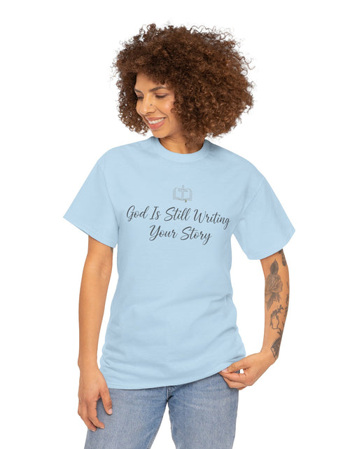 Load image into Gallery viewer, God Is Still Writing Your Story Tee — Inspirational Christian Faith Men's &amp; Women's T-Shirt
