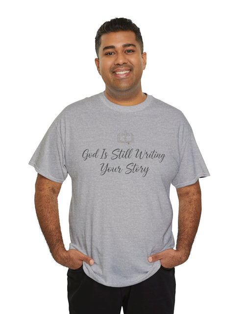 Load image into Gallery viewer, God Is Still Writing Your Story Tee — Inspirational Christian Faith Men's &amp; Women's T-Shirt
