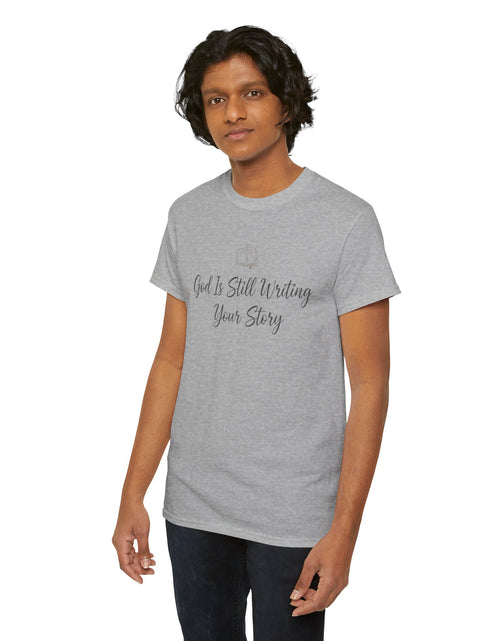 Load image into Gallery viewer, God Is Still Writing Your Story Tee — Inspirational Christian Faith Men's &amp; Women's T-Shirt
