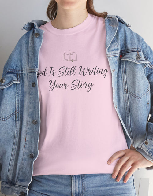 Load image into Gallery viewer, God Is Still Writing Your Story Tee — Inspirational Christian Faith Men's &amp; Women's T-Shirt
