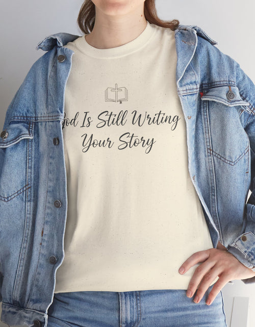 Load image into Gallery viewer, God Is Still Writing Your Story Tee — Inspirational Christian Faith Men's &amp; Women's T-Shirt

