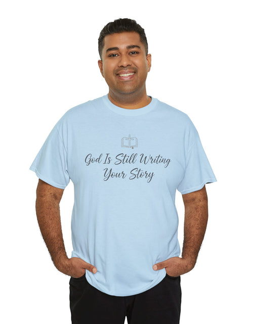 Load image into Gallery viewer, God Is Still Writing Your Story Tee — Inspirational Christian Faith Men's &amp; Women's T-Shirt
