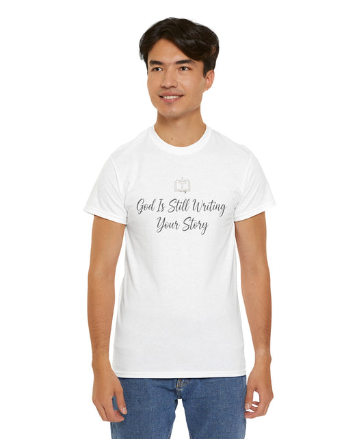 Load image into Gallery viewer, God Is Still Writing Your Story Tee — Inspirational Christian Faith Men's &amp; Women's T-Shirt
