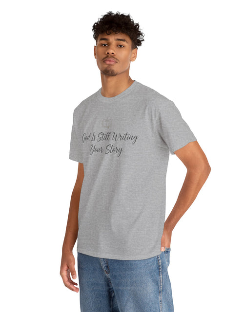 Load image into Gallery viewer, God Is Still Writing Your Story Tee — Inspirational Christian Faith Men's &amp; Women's T-Shirt
