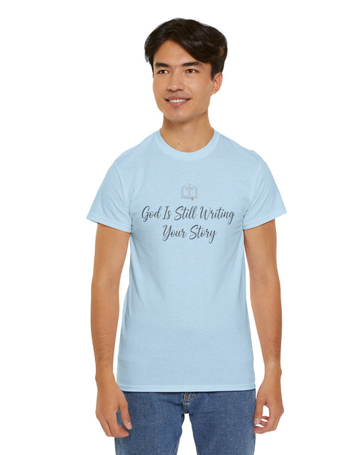 Load image into Gallery viewer, God Is Still Writing Your Story Tee — Inspirational Christian Faith Men's &amp; Women's T-Shirt
