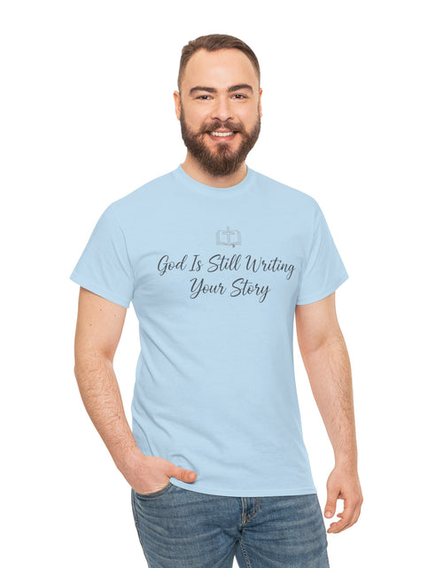 Load image into Gallery viewer, God Is Still Writing Your Story Tee — Inspirational Christian Faith Men's &amp; Women's T-Shirt
